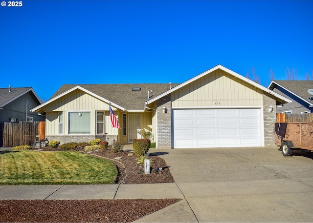 ranch-style house with a garage and a front yard