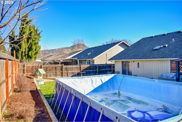 view of swimming pool featuring a mountain view