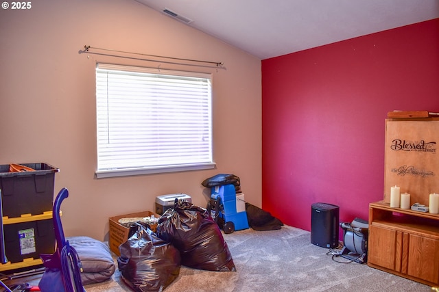 game room with vaulted ceiling and carpet