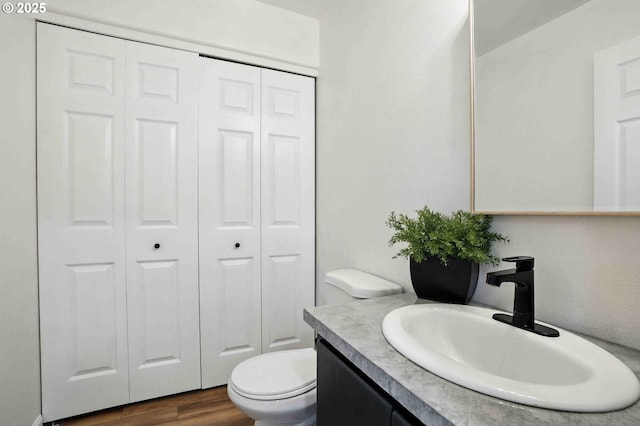 1103 W 34th Way, Vancouver, WA 98660 - bathroom featuring a closet, vanity, and wood finished floors