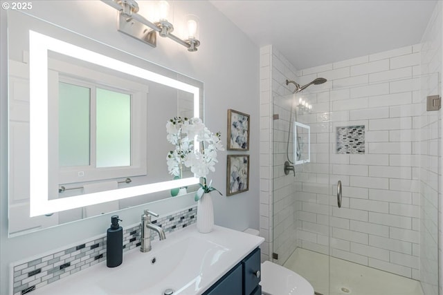 full bath with vanity, toilet, a stall shower, and decorative backsplash