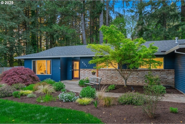 view of front of property with roof with shingles