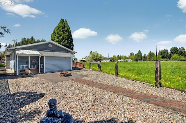 exterior space featuring an outdoor fire pit