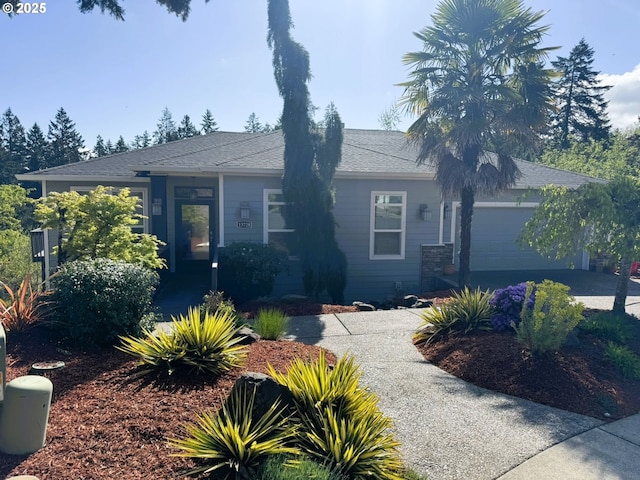 view of front facade with an attached garage and concrete driveway