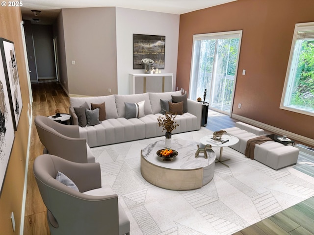 living area featuring baseboards and wood finished floors