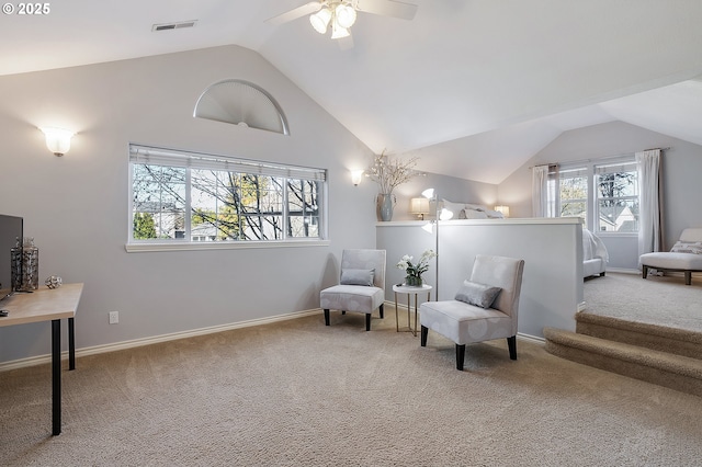 sitting room featuring ceiling fan, lofted ceiling, and light carpet