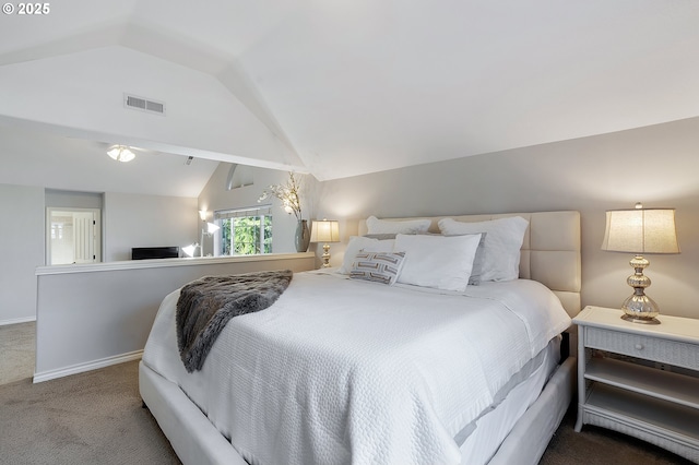 carpeted bedroom featuring lofted ceiling