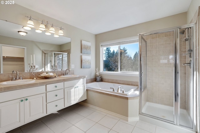 bathroom with vanity, tile patterned floors, and shower with separate bathtub