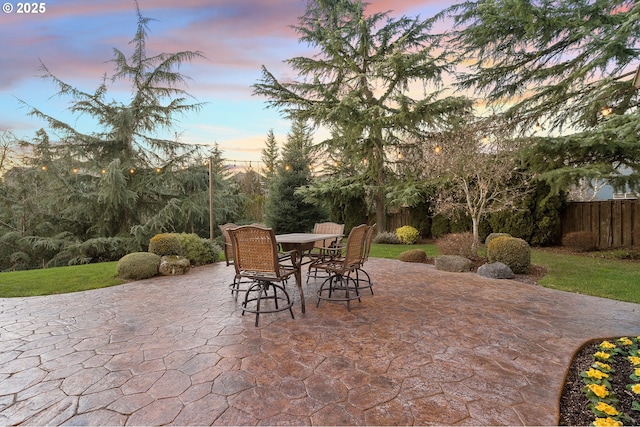 view of patio terrace at dusk