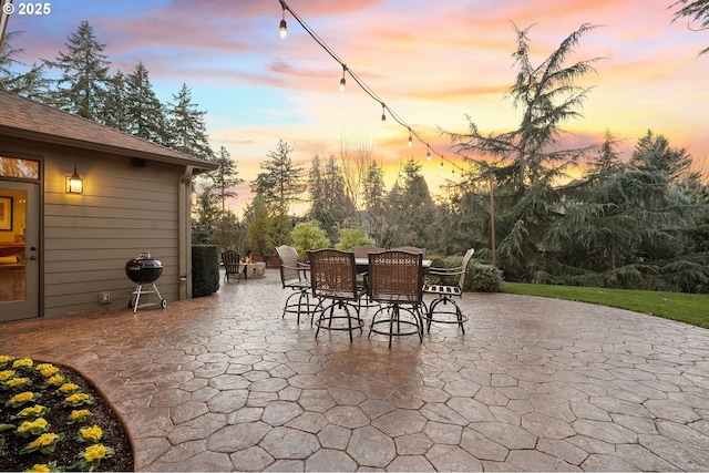 view of patio terrace at dusk