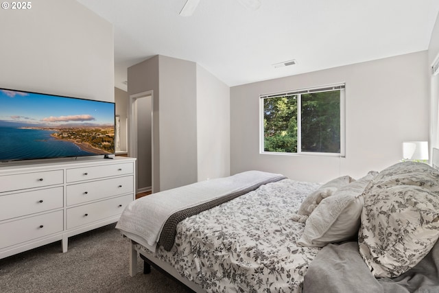 bedroom featuring dark colored carpet and a ceiling fan