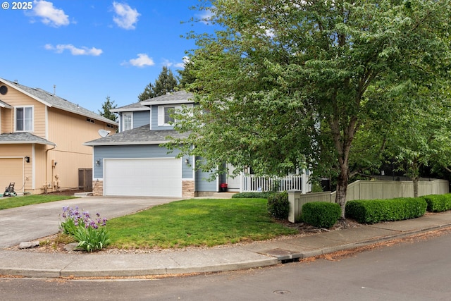 view of property hidden behind natural elements featuring concrete driveway, an attached garage, and roof with shingles
