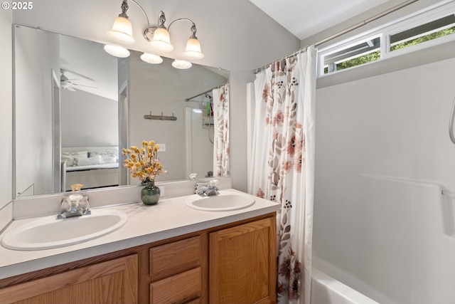 bathroom with double vanity, shower / tub combo, and ceiling fan