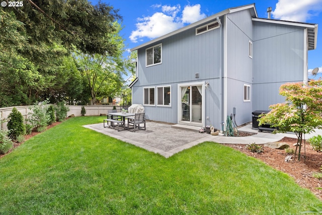 back of property with a patio