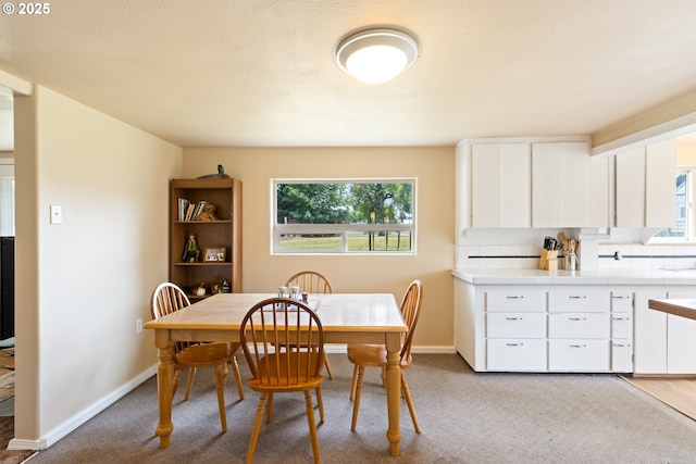 1548 Harlan St, Roseburg, OR 97471 - dining area featuring baseboards and light carpet