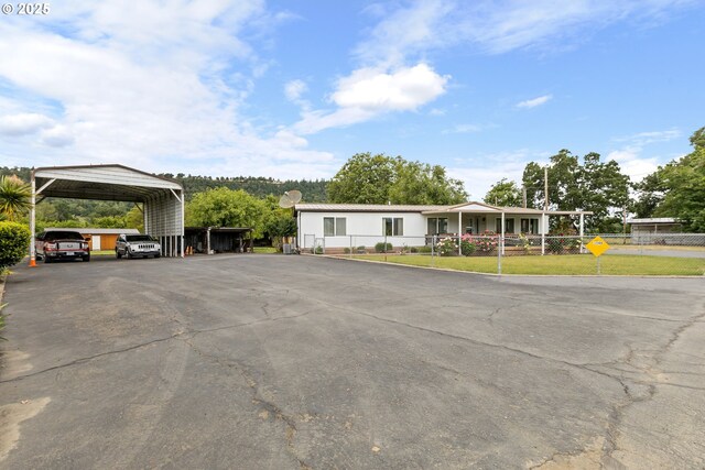 1548 Harlan St, Roseburg, OR 97471 - manufactured / mobile home with driveway and a detached carport