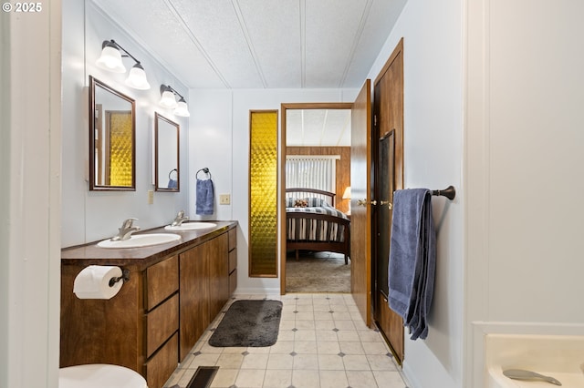 1548 Harlan St, Roseburg, OR 97471 - ensuite bathroom featuring double vanity and a textured ceiling