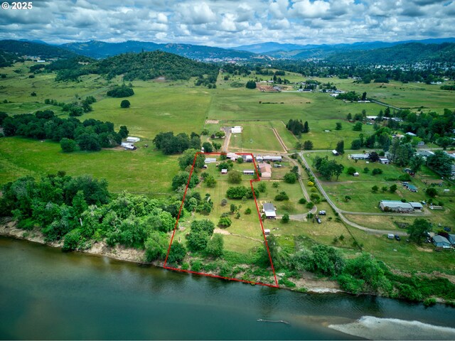 1548 Harlan St, Roseburg, OR 97471 - aerial view of sparsely populated area with property boundaries highlighted and a water and mountain view