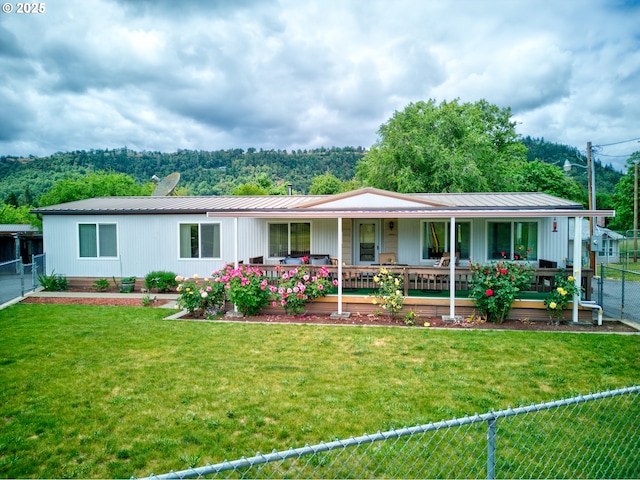 1548 Harlan St, Roseburg, OR 97471 - view of front of property featuring covered porch, a metal roof, and a fenced backyard