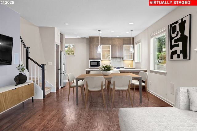 dining room featuring recessed lighting, stairs, dark wood-type flooring, and baseboards