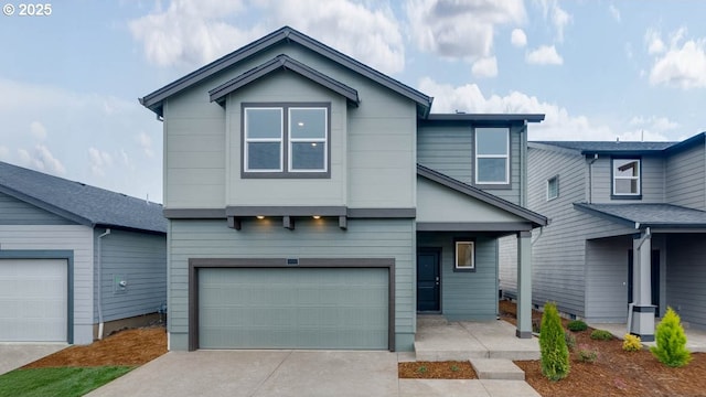 view of front facade featuring an attached garage and driveway