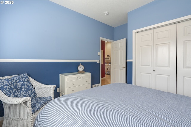 bedroom featuring a closet and baseboards