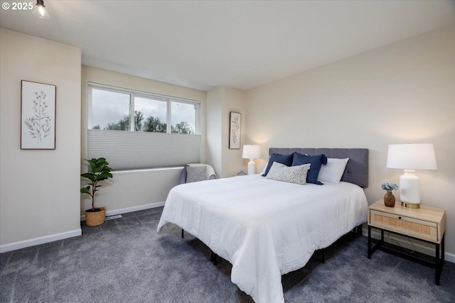 bedroom with carpet flooring and baseboards