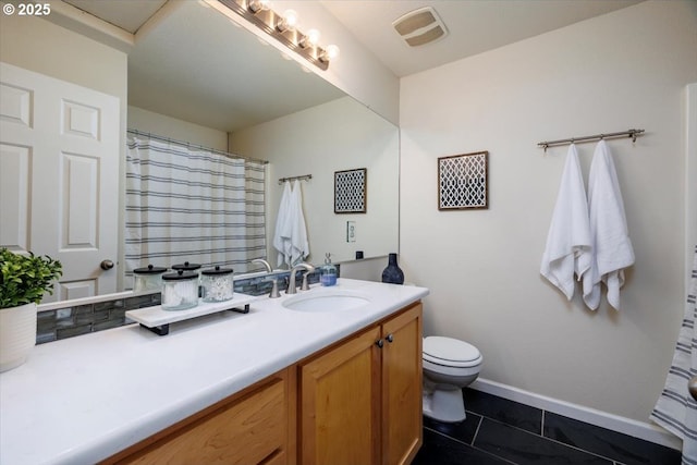 bathroom featuring visible vents, toilet, tile patterned flooring, baseboards, and vanity