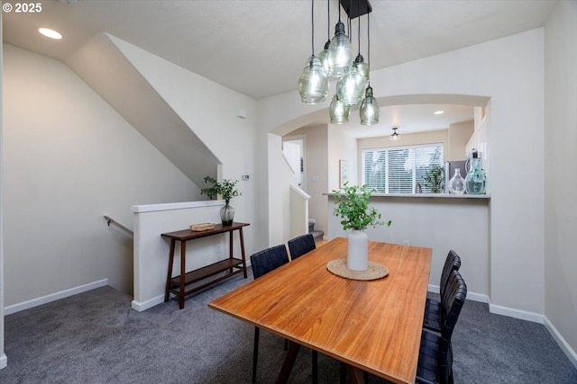 dining area featuring recessed lighting, arched walkways, baseboards, and carpet floors