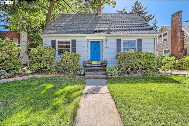3954 NE 38th Ave, Portland, OR 97212 - view of front of home with a front yard and a chimney