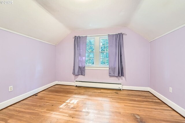 3954 NE 38th Ave, Portland, OR 97212 - bonus room featuring baseboard heating, lofted ceiling, and wood finished floors