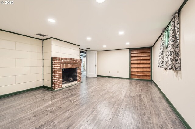 3954 NE 38th Ave, Portland, OR 97212 - unfurnished living room featuring wood finished floors, a fireplace, and recessed lighting