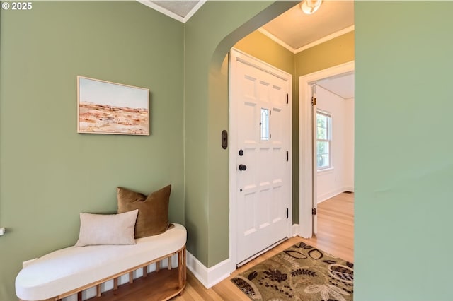 3954 NE 38th Ave, Portland, OR 97212 - entrance foyer featuring crown molding, arched walkways, and wood finished floors