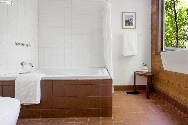 full bathroom with tile patterned flooring and toilet