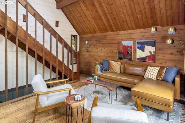 living area with wooden ceiling, wooden walls, vaulted ceiling with beams, and wood finished floors