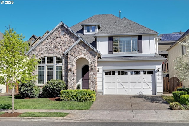 13129 NW Alvada St, Portland, OR 97229 - view of front of house with an attached garage, stone siding, driveway, and roof with shingles