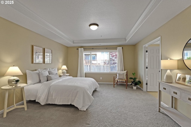 13129 NW Alvada St, Portland, OR 97229 - bedroom with crown molding, a tray ceiling, a textured ceiling, light carpet, and baseboards