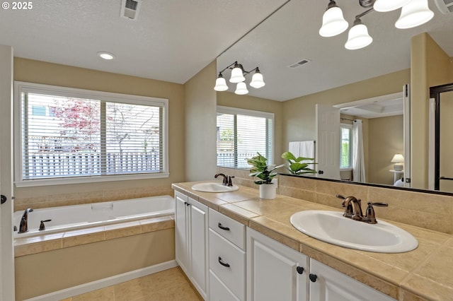13129 NW Alvada St, Portland, OR 97229 - bathroom featuring a garden tub, a sink, and plenty of natural light