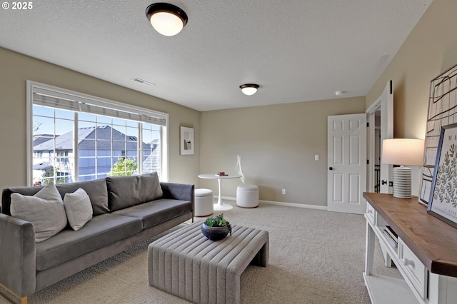13129 NW Alvada St, Portland, OR 97229 - living area with carpet floors, baseboards, visible vents, and a textured ceiling