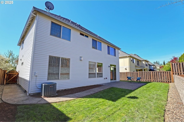 13129 NW Alvada St, Portland, OR 97229 - back of property with central air condition unit, a fenced backyard, a lawn, a patio area, and a gate