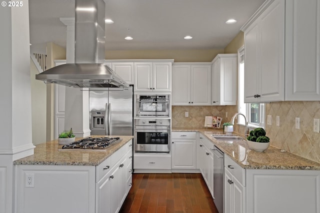 13129 NW Alvada St, Portland, OR 97229 - kitchen with white cabinetry, appliances with stainless steel finishes, island exhaust hood, a sink, and dark wood-style floors