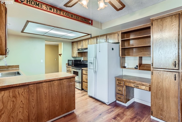 kitchen featuring stainless steel electric range oven, white fridge with ice dispenser, sink, dark hardwood / wood-style flooring, and ceiling fan