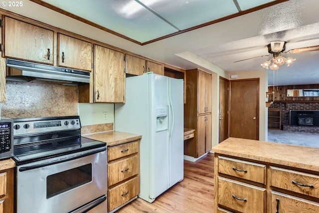 kitchen featuring white fridge with ice dispenser, light hardwood / wood-style floors, backsplash, ceiling fan, and electric range