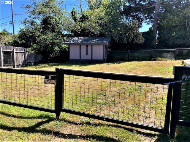 view of yard featuring a shed and an outdoor structure