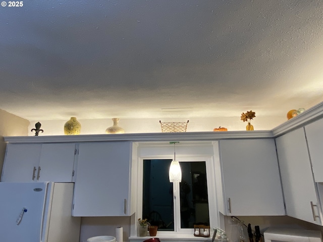 kitchen view of freestanding refrigerator