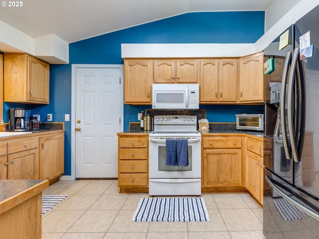 12309 SE Riveridge Dr, Vancouver, WA 98683 - kitchen with white appliances, vaulted ceiling, and light tile patterned floors