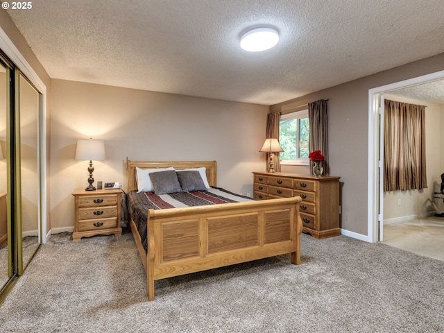 12309 SE Riveridge Dr, Vancouver, WA 98683 - bedroom with a textured ceiling, light carpet, a closet, and baseboards