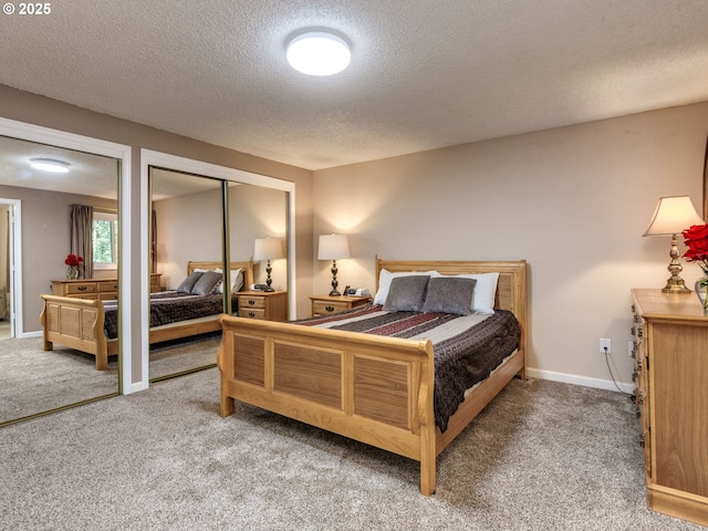 12309 SE Riveridge Dr, Vancouver, WA 98683 - bedroom with carpet, a textured ceiling, multiple closets, and baseboards