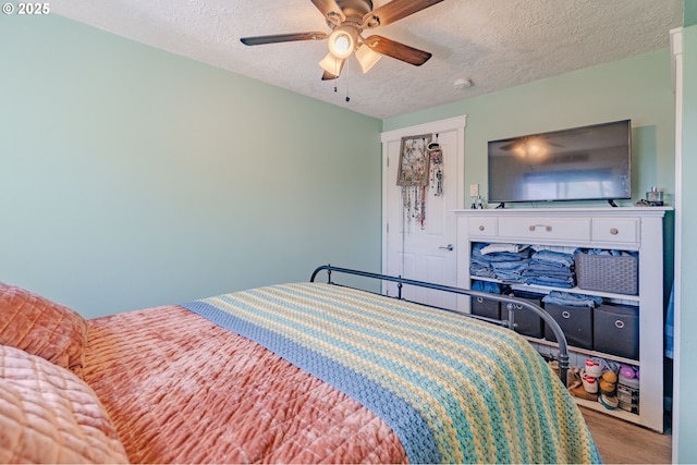 4309 C St, Washougal, WA 98671 - bedroom featuring a textured ceiling, wood finished floors, and a ceiling fan
