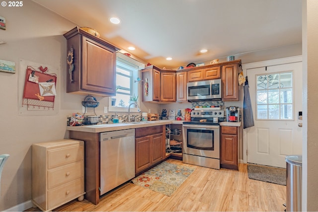 4309 C St, Washougal, WA 98671 - kitchen with stainless steel appliances, plenty of natural light, a sink, light wood-style floors, and recessed lighting